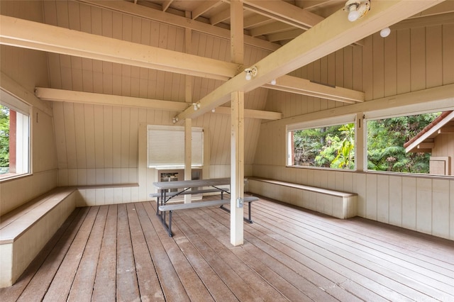 84-707 Kiana Pl Unit 107B, Waianae, HI 96792 - workout area featuring hardwood / wood-style floors, vaulted ceiling, and wood walls