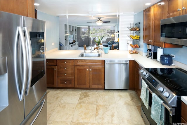 500 Lunalilo Home Rd Unit 22B, Honolulu, HI 96825 - kitchen featuring stainless steel appliances, a sink, a ceiling fan, brown cabinets, and light countertops