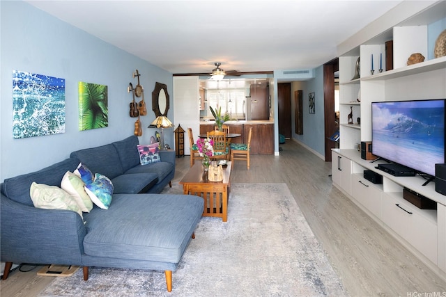 500 Lunalilo Home Rd Unit 22B, Honolulu, HI 96825 - living area with light wood-style floors and a ceiling fan
