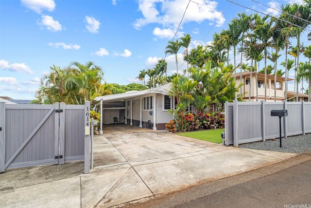 1614 Hoolulu Rd, Wahiawa, HI 96786 - view of front of home with a gate, driveway, and an attached carport