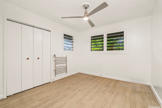 1614 Hoolulu Rd, Wahiawa, HI 96786 - unfurnished bedroom featuring light wood-style floors, a closet, and a ceiling fan