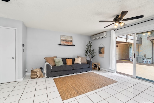 68-077 Au St Unit 2D, Waialua, HI 96791 - living area featuring a wall mounted AC, a textured ceiling, ceiling fan, and light tile patterned floors