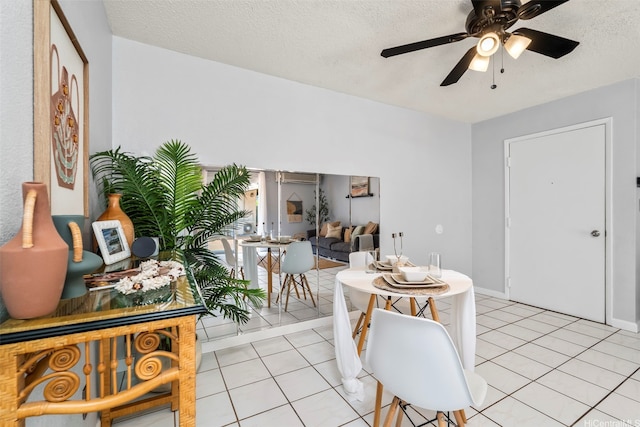 68-077 Au St Unit 2D, Waialua, HI 96791 - dining room with ceiling fan, light tile patterned flooring, a textured ceiling, and an AC wall unit