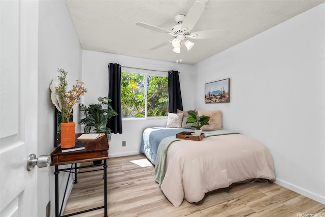 68-077 Au St Unit 2D, Waialua, HI 96791 - bedroom featuring light wood-type flooring, baseboards, and ceiling fan