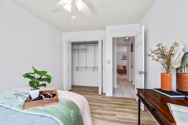 68-077 Au St Unit 2D, Waialua, HI 96791 - bedroom featuring light wood finished floors, a closet, ceiling fan, and baseboards