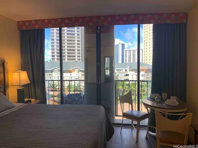1850 Ala Moana Blvd Unit 223, Honolulu, HI 96815 - bedroom featuring wood finished floors and access to outside