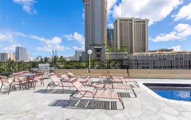 1850 Ala Moana Blvd Unit 223, Honolulu, HI 96815 - view of swimming pool featuring a skyline view, a patio area, and a swimming pool