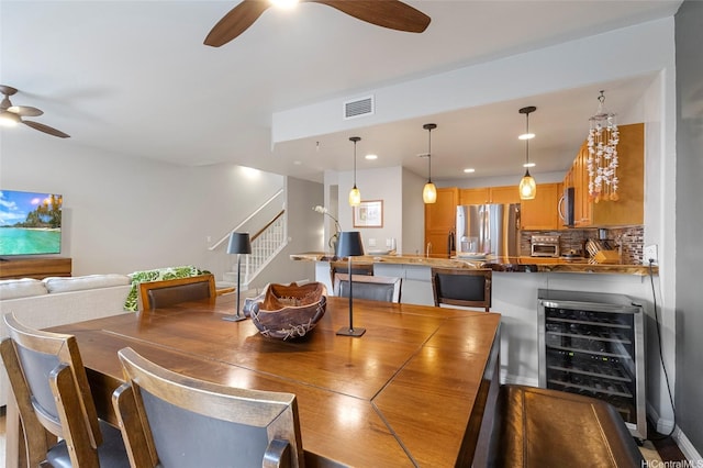 7012 Hawaii Kai Dr Unit 904, Honolulu, HI 96825 - dining space featuring ceiling fan, stairs, wine cooler, and recessed lighting