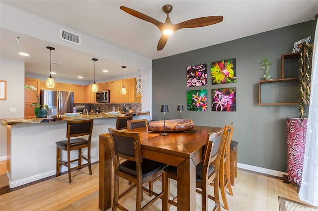 7012 Hawaii Kai Dr Unit 904, Honolulu, HI 96825 - dining space featuring light wood-type flooring, recessed lighting, ceiling fan, and baseboards