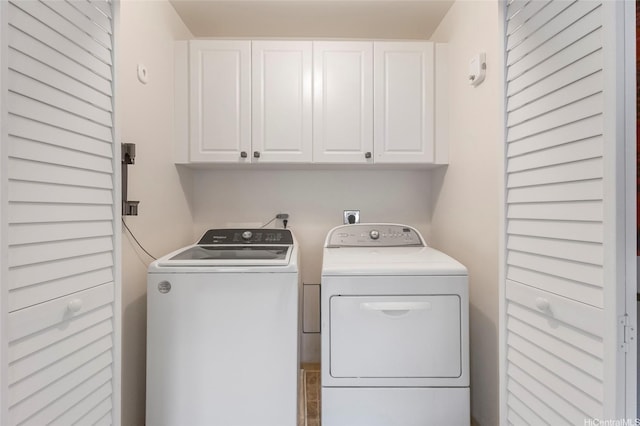 7012 Hawaii Kai Dr Unit 904, Honolulu, HI 96825 - laundry room featuring washer and dryer and cabinet space