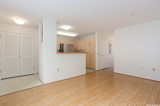 95-1025 Kaapeha St Unit 203, Mililani, HI 96789 - unfurnished living room featuring light wood-style floors and electric panel