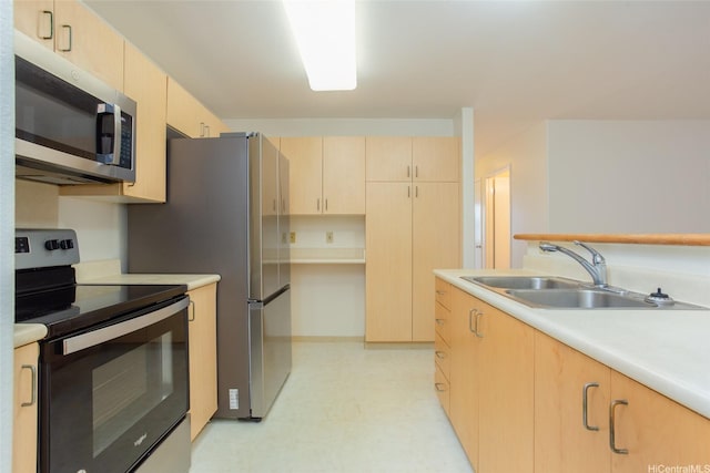 95-1025 Kaapeha St Unit 203, Mililani, HI 96789 - kitchen with range with electric stovetop, stainless steel microwave, light brown cabinets, a sink, and light flooring
