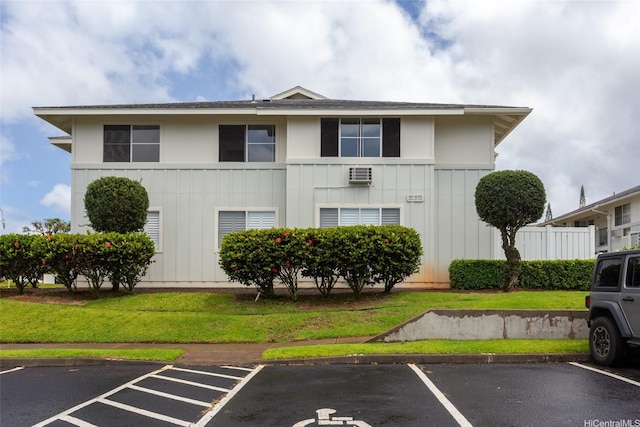 95-1025 Kaapeha St Unit 203, Mililani, HI 96789 - view of building exterior featuring uncovered parking and an AC wall unit