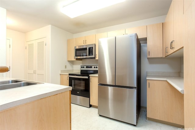 95-1025 Kaapeha St Unit 203, Mililani, HI 96789 - kitchen featuring stainless steel appliances, light brown cabinets, a sink, light flooring, and light countertops