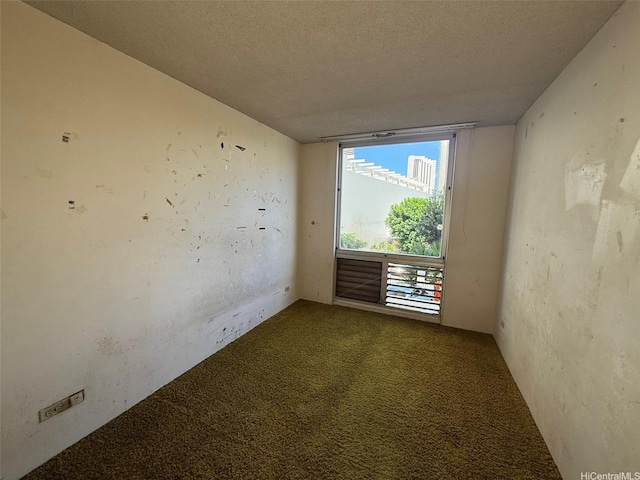 1717 Ala Wai Blvd Unit 306, Honolulu, HI 96815 - spare room with carpet and a textured ceiling