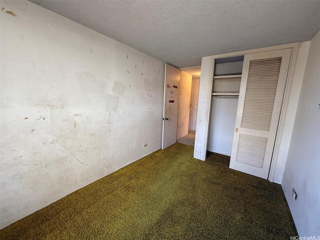 1717 Ala Wai Blvd Unit 306, Honolulu, HI 96815 - unfurnished bedroom featuring a textured ceiling, carpet flooring, and a closet