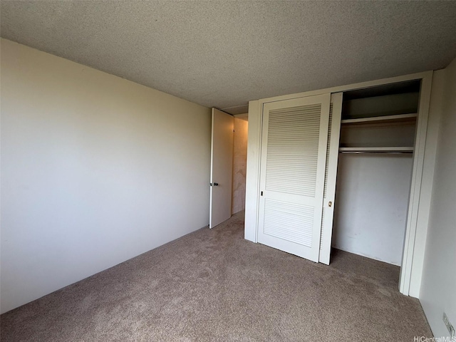 1717 Ala Wai Blvd Unit 306, Honolulu, HI 96815 - unfurnished bedroom with carpet flooring, a closet, and a textured ceiling