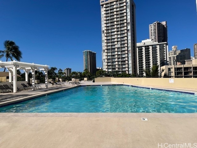 444 Niu St Unit 1312, Honolulu, HI 96815 - community pool featuring a pergola, a patio area, and a view of city