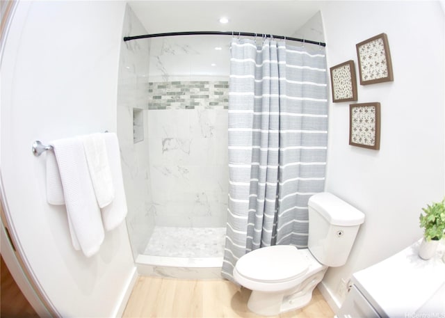 3823 Lower Honoapiilani Rd Unit 105, Lahaina, HI 96761 - full bathroom with toilet, curtained shower, wood finished floors, and baseboards