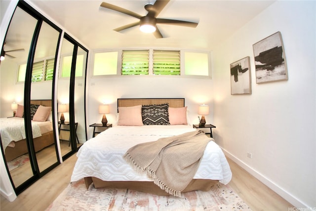 3823 Lower Honoapiilani Rd Unit 105, Lahaina, HI 96761 - bedroom featuring wood finished floors, baseboards, and a ceiling fan