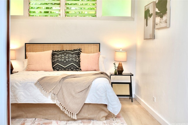 3823 Lower Honoapiilani Rd Unit 105, Lahaina, HI 96761 - bedroom featuring baseboards and wood finished floors