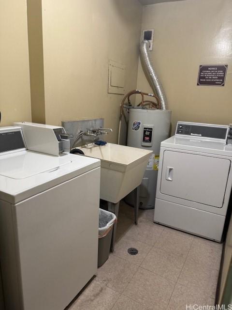 303 Liliuokalani Ave Unit 602, Honolulu, HI 96815 - laundry area with a sink, water heater, and washer and clothes dryer