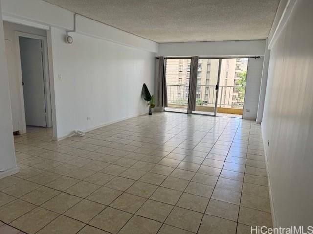 303 Liliuokalani Ave Unit 602, Honolulu, HI 96815 - unfurnished room featuring a textured ceiling and tile patterned flooring