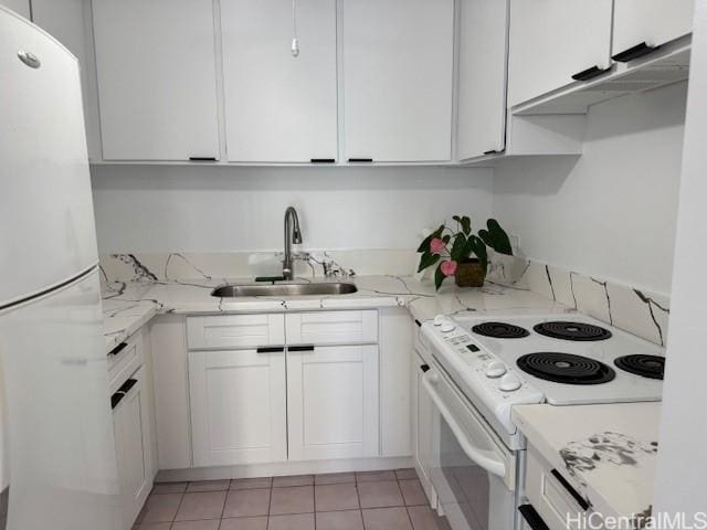 303 Liliuokalani Ave Unit 602, Honolulu, HI 96815 - kitchen with white appliances, white cabinets, light tile patterned flooring, and light stone counters