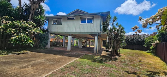 67-213 Niumaloo Pl, Waialua, HI 96791 - view of front facade featuring a carport, driveway, and stairway