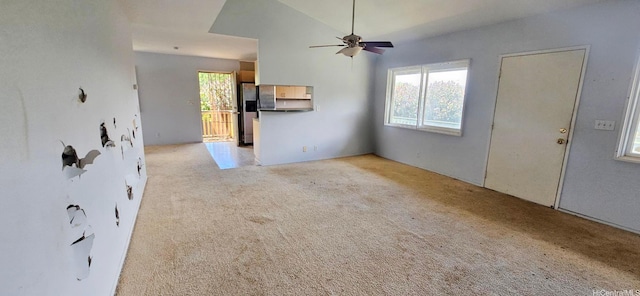 67-213 Niumaloo Pl, Waialua, HI 96791 - unfurnished living room with light colored carpet, a ceiling fan, and vaulted ceiling