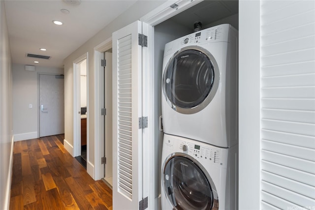 1108 Auahi St Unit 3108, Honolulu, HI 96814 - laundry area featuring stacked washer and clothes dryer, dark wood-style floors, recessed lighting, and baseboards