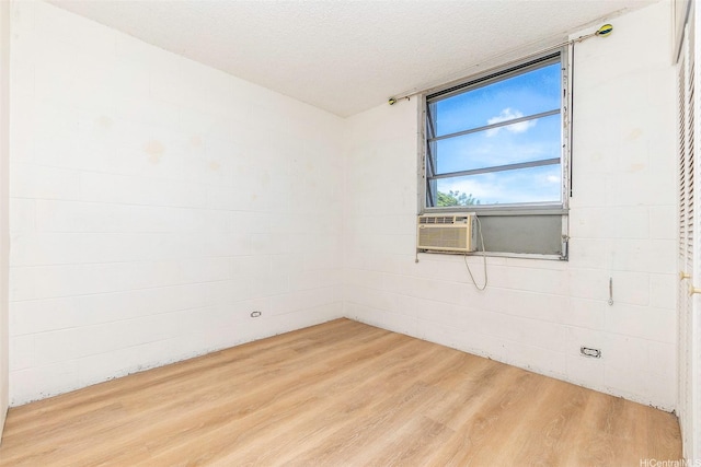 98-1040 Moanalua Rd Unit 1-201, Aiea, HI 96701 - spare room featuring wood finished floors and cooling unit