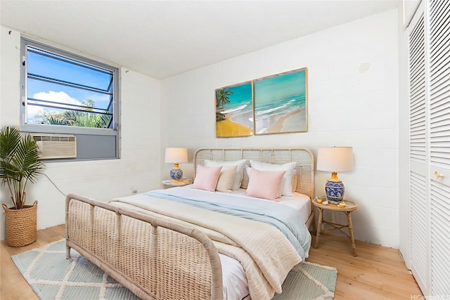 98-1040 Moanalua Rd Unit 1-201, Aiea, HI 96701 - bedroom featuring wood finished floors and concrete block wall