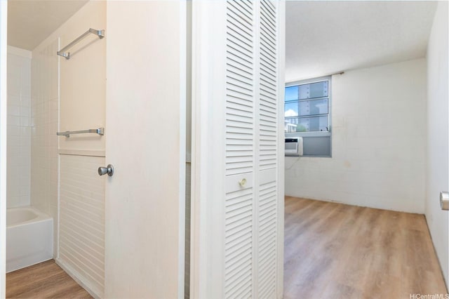 98-1040 Moanalua Rd Unit 1-201, Aiea, HI 96701 - full bath with a closet, wood finished floors, and shower / bath combination