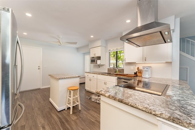 95-280 Ualalehu St Unit 18, Mililani, HI 96789 - kitchen featuring wall chimney range hood, stainless steel appliances, dark wood-style flooring, a kitchen island, and a sink