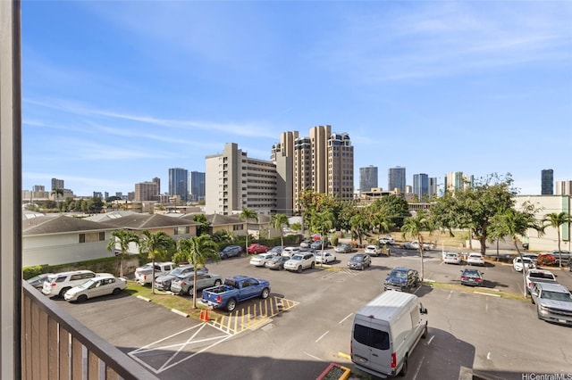 1050 Kinau St Unit 301, Honolulu, HI 96814 - uncovered parking lot with a view of skyline