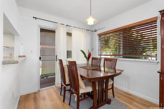 94-217A Kikepa Pl, Waipahu, HI 96797 - dining area with baseboards, light wood-style flooring, and plenty of natural light