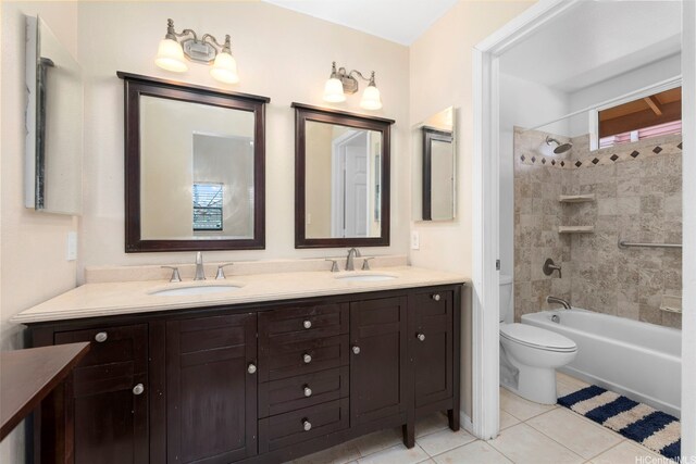 94-217A Kikepa Pl, Waipahu, HI 96797 - bathroom featuring double vanity, toilet, tile patterned floors, and bathtub / shower combination
