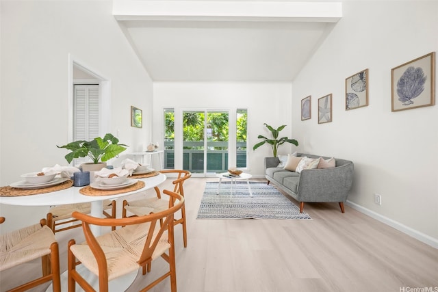 355 Aoloa St Unit D203, Kailua, HI 96734 - living room with lofted ceiling, light wood-style floors, and baseboards