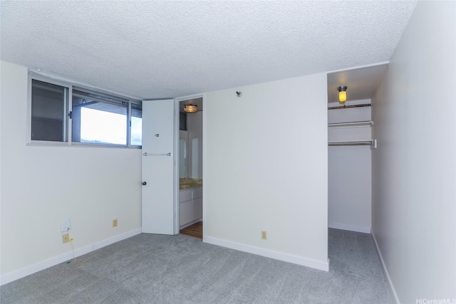 2916 Date St Unit 10I, Honolulu, HI 96816 - unfurnished bedroom with a textured ceiling, carpet flooring, and baseboards