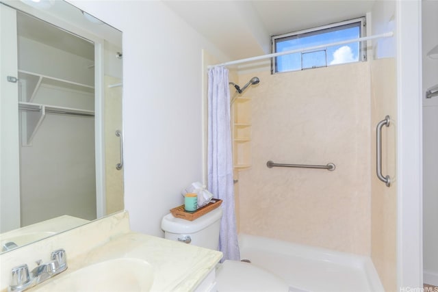 2916 Date St Unit 10I, Honolulu, HI 96816 - full bath featuring curtained shower, toilet, vanity, and a walk in closet