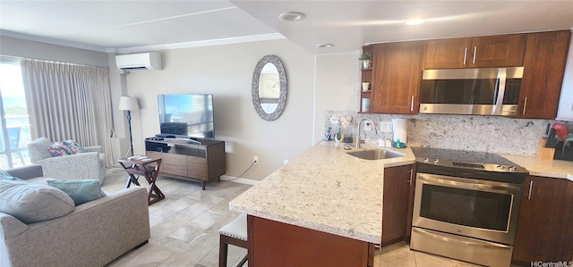 1777 Ala Moana Blvd Unit 1506, Honolulu, HI 96815 - kitchen featuring appliances with stainless steel finishes, open floor plan, a sink, an AC wall unit, and tasteful backsplash