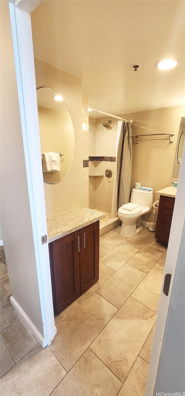 1777 Ala Moana Blvd Unit 1506, Honolulu, HI 96815 - full bathroom featuring vanity, a tile shower, toilet, tile patterned flooring, and recessed lighting