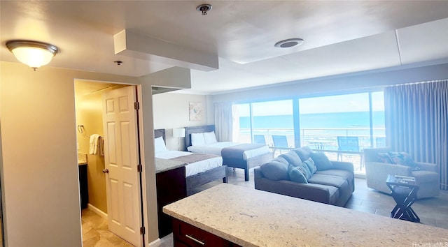 1777 Ala Moana Blvd Unit 1506, Honolulu, HI 96815 - bedroom featuring multiple windows, a water view, and light tile patterned flooring