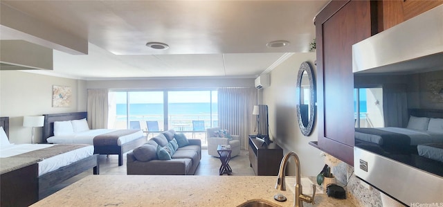 1777 Ala Moana Blvd Unit 1506, Honolulu, HI 96815 - bedroom with crown molding, an AC wall unit, wood finished floors, and a sink