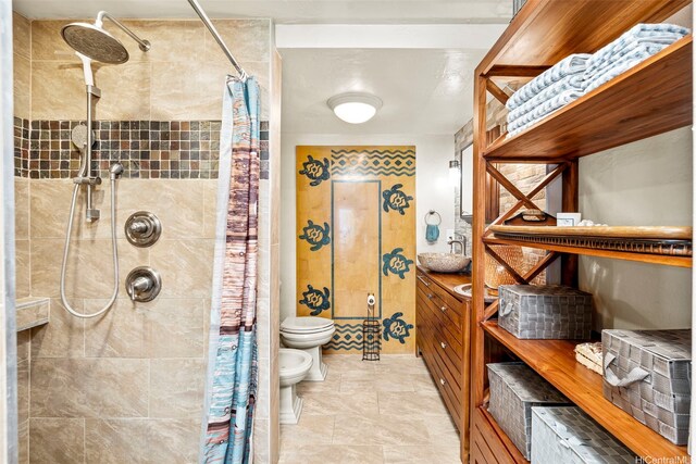 87-561 Farrington Hwy Unit 102, Waianae, HI 96792 - bathroom with a bidet, toilet, vanity, and a tile shower