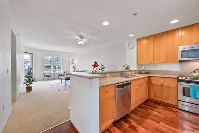 520 Lunalilo Home Rd Unit 7411, Honolulu, HI 96825 - kitchen with appliances with stainless steel finishes, a sink, a peninsula, wood finished floors, and recessed lighting