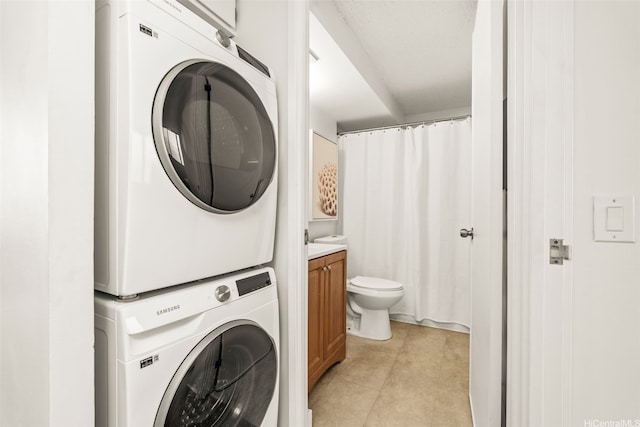 502 Captain Cook Ave Unit 301, Honolulu, HI 96813 - laundry room featuring stacked washer / drying machine and light tile patterned floors