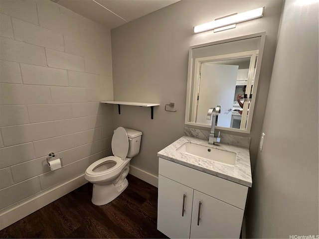 803 Waimanu St Unit 109, Honolulu, HI 96813 - bathroom featuring wood finished floors, vanity, toilet, and baseboards