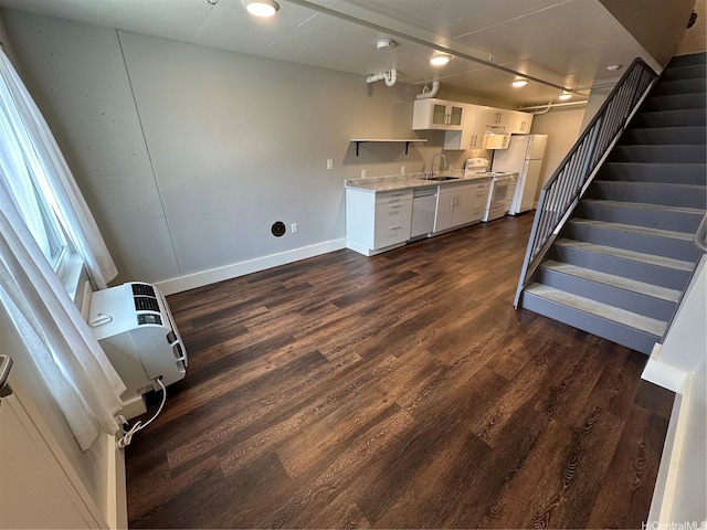 803 Waimanu St Unit 109, Honolulu, HI 96813 - kitchen featuring white appliances, dark wood finished floors, white cabinets, light countertops, and a sink